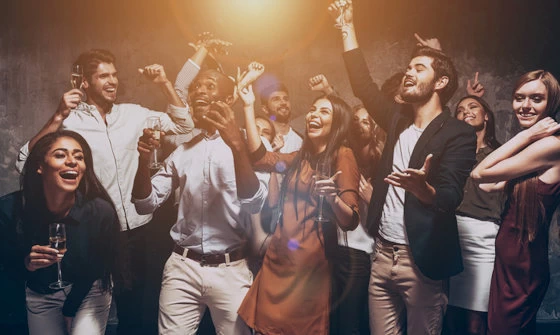 Group of young adults having a good time at a party